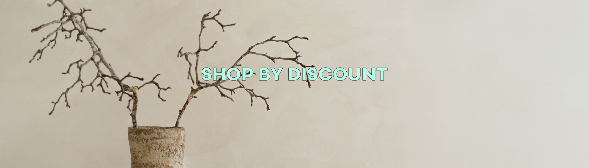 Vase with branches on a beige background 