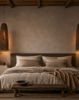 Cozy bedroom with wooden bed, hanging lamps, and decorative elements.