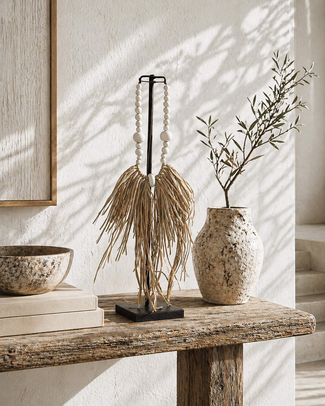 Decorative items on a wooden surface with a neutral background