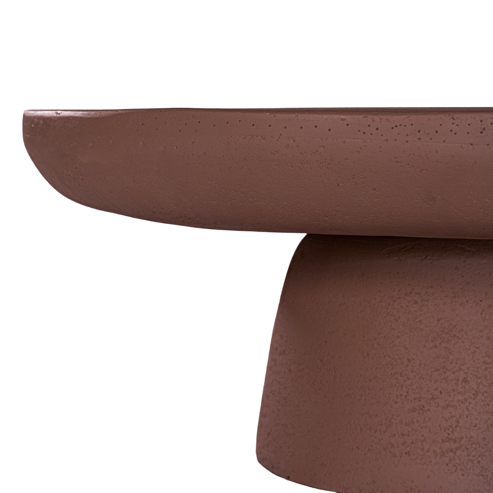 Tarran coffee table in cinnabar clay finish with rounded top and sculptural cylindrical leg