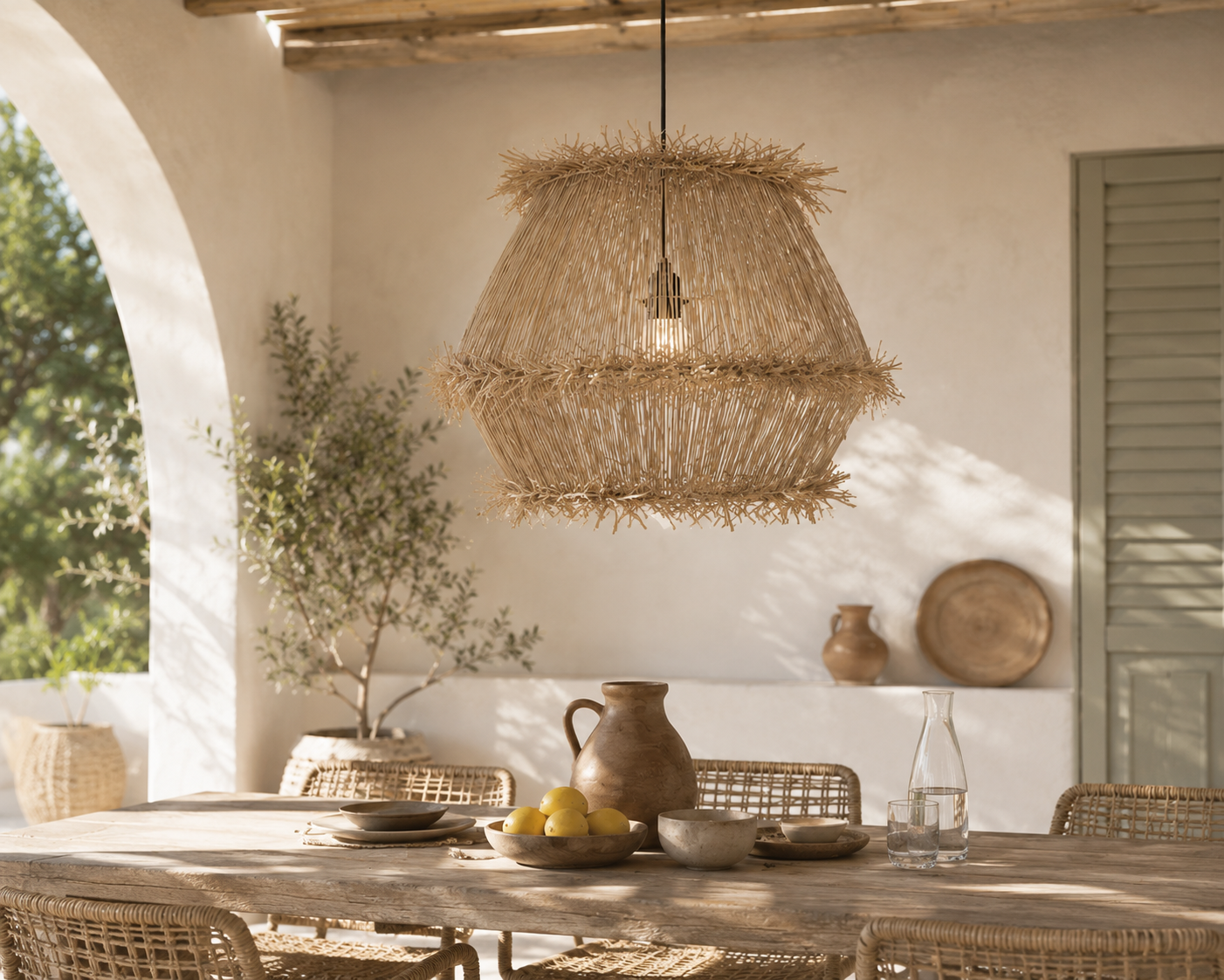 Woven pendant light hanging above a dining table with rustic decor.