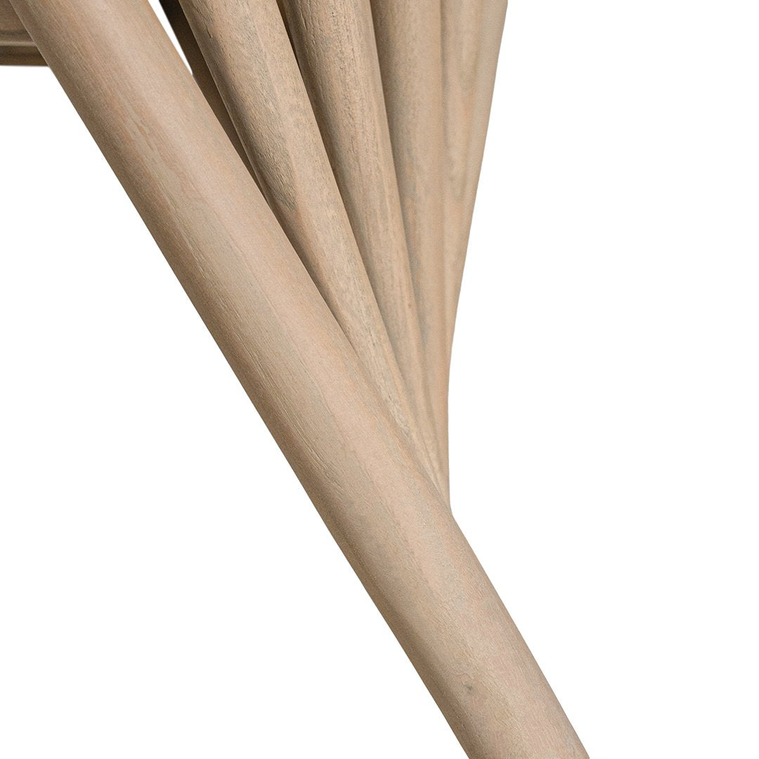 Lightwood spindle dining chair with a curved backrest and white upholstered seat, showcasing a modern yet timeless design. Crafted from solid wood, this chair brings a refined, natural aesthetic to any dining or living space