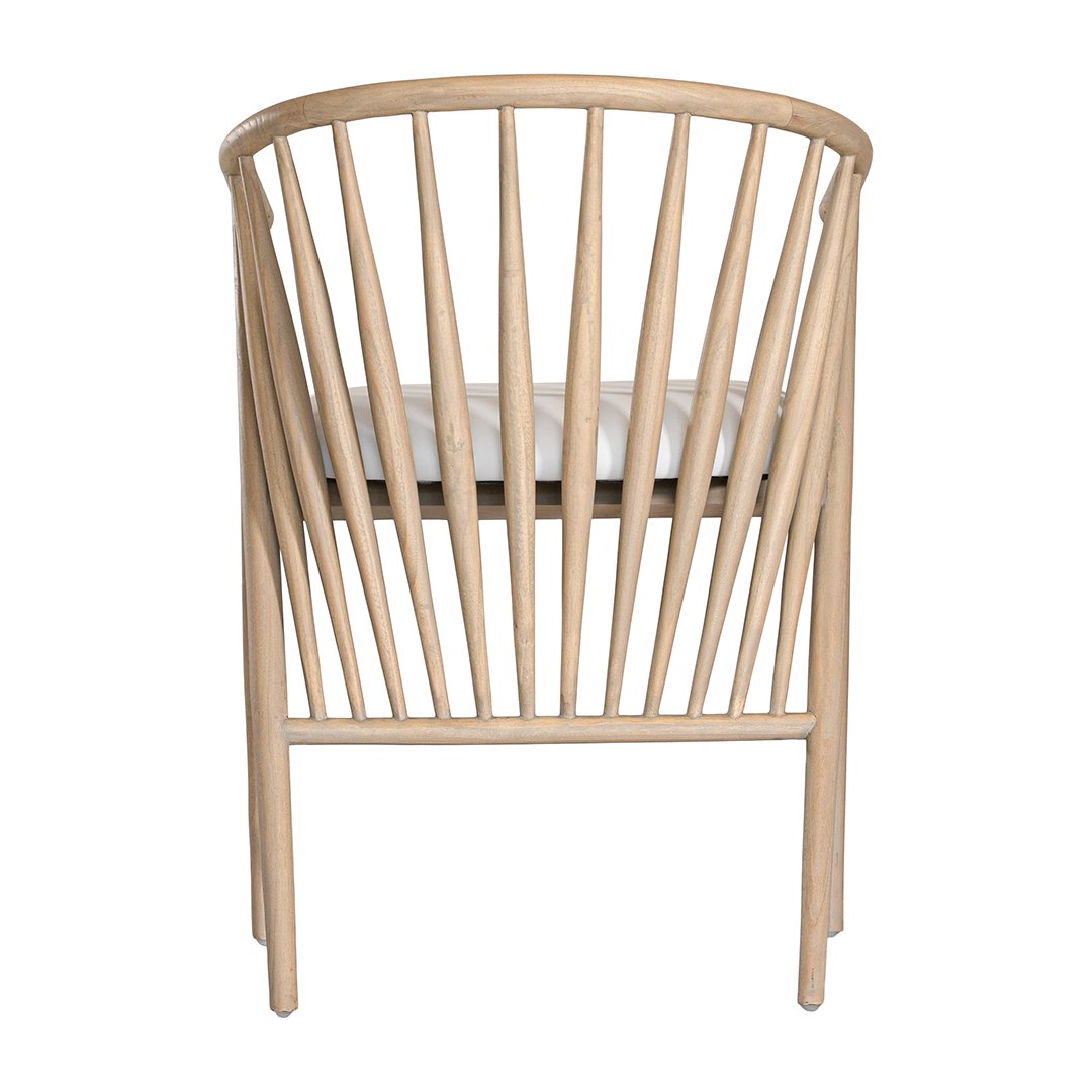 Lightwood spindle dining chair with a curved backrest and white upholstered seat, showcasing a modern yet timeless design. Crafted from solid wood, this chair brings a refined, natural aesthetic to any dining or living space
