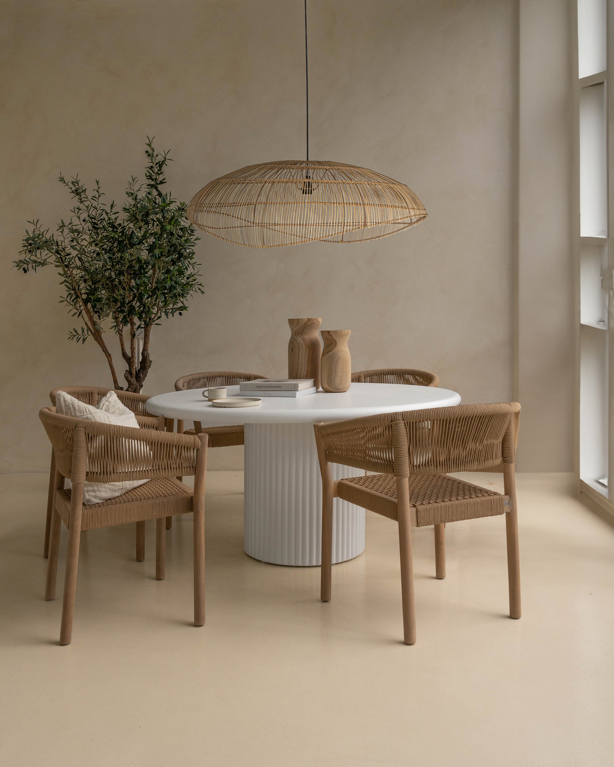 Kulala Living Alama Table paired with Maji Pendant, Citiku Vases, and Coron Chairs. A refined, natural aesthetic featuring woven textures and sculptural design, perfect for modern interiors