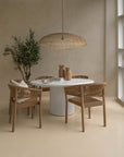 Kulala Living Alama Table paired with Maji Pendant, Citiku Vases, and Coron Chairs. A refined, natural aesthetic featuring woven textures and sculptural design, perfect for modern interiors