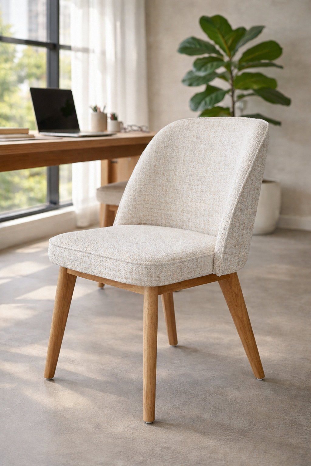 Alma dining chair in seashell tone with soft upholstery and rope detailing styled at a timber desk in a calm modern australian interior