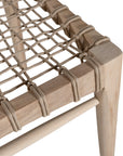 Modern lightwood dining chair featuring a sculpted timber backrest and a handwoven rope seat. A perfect blend of natural materials and contemporary craftsmanship for stylish dining spaces