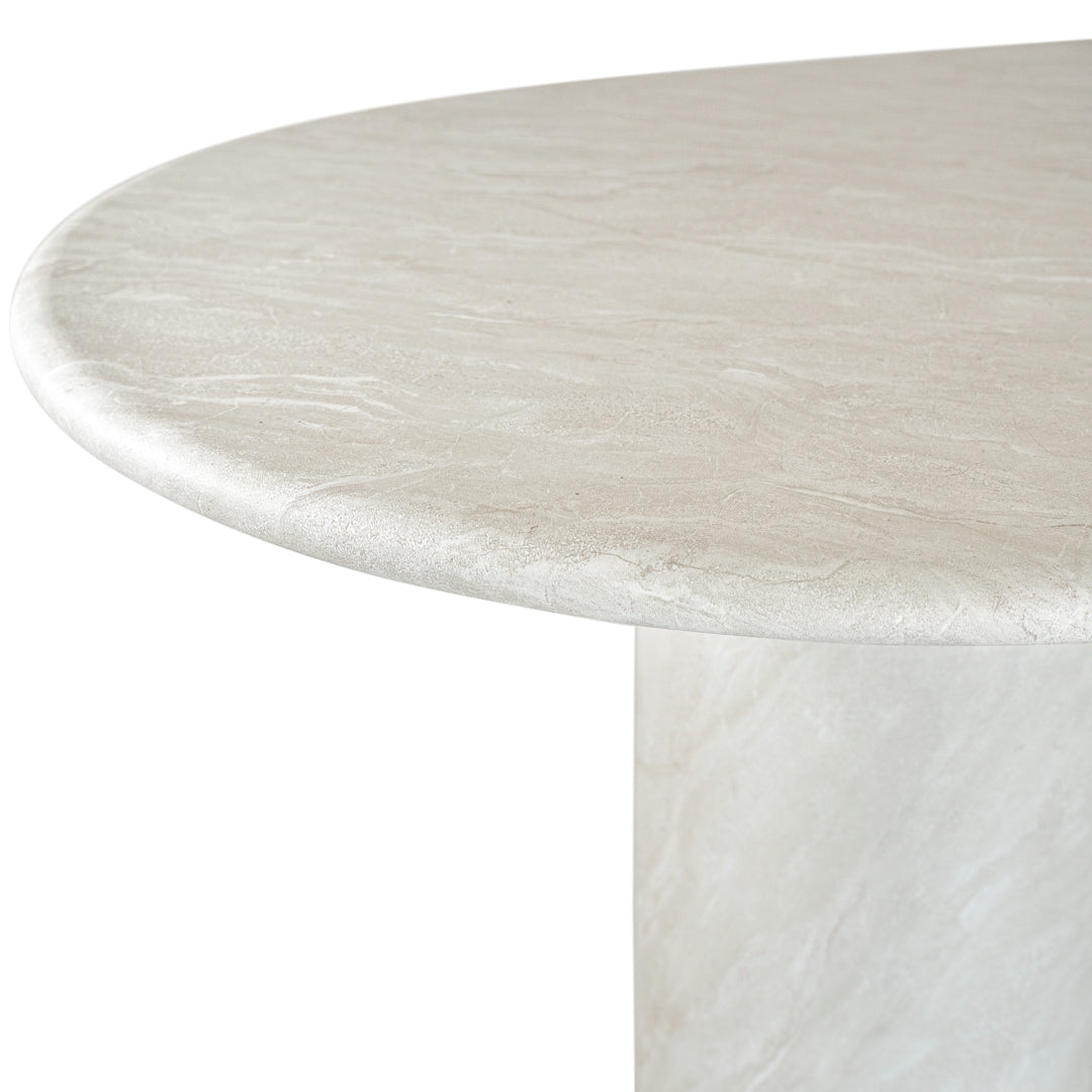 Ayanda dining table in eggshell hydro dipped finish with oval tabletop and two cylindrical pedestal bases.