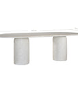 Ayanda dining table in eggshell hydro dipped finish with oval tabletop and two cylindrical pedestal bases.