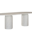 Ayanda dining table in eggshell hydro dipped finish with oval tabletop and two cylindrical pedestal bases.