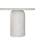 Ayanda dining table in eggshell hydro dipped finish with oval tabletop and two cylindrical pedestal bases.
