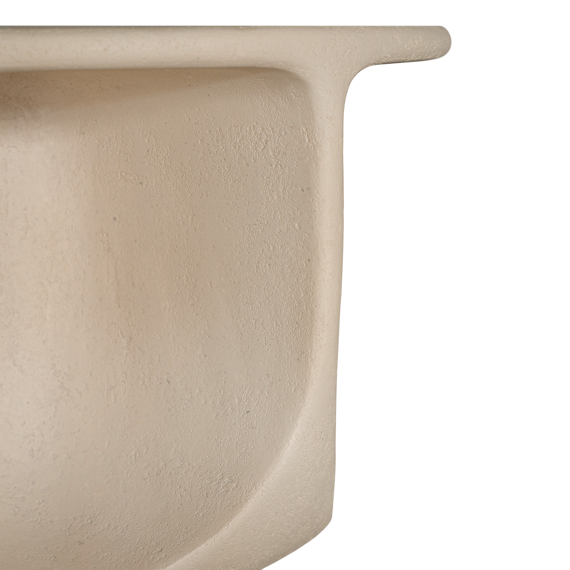 Berber coffee table in driftstone finish featuring sculptural curved legs and a softly rounded top with a textured natural surface.
