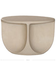 Berber coffee table in driftstone finish featuring sculptural curved legs and a softly rounded top with a textured natural surface.