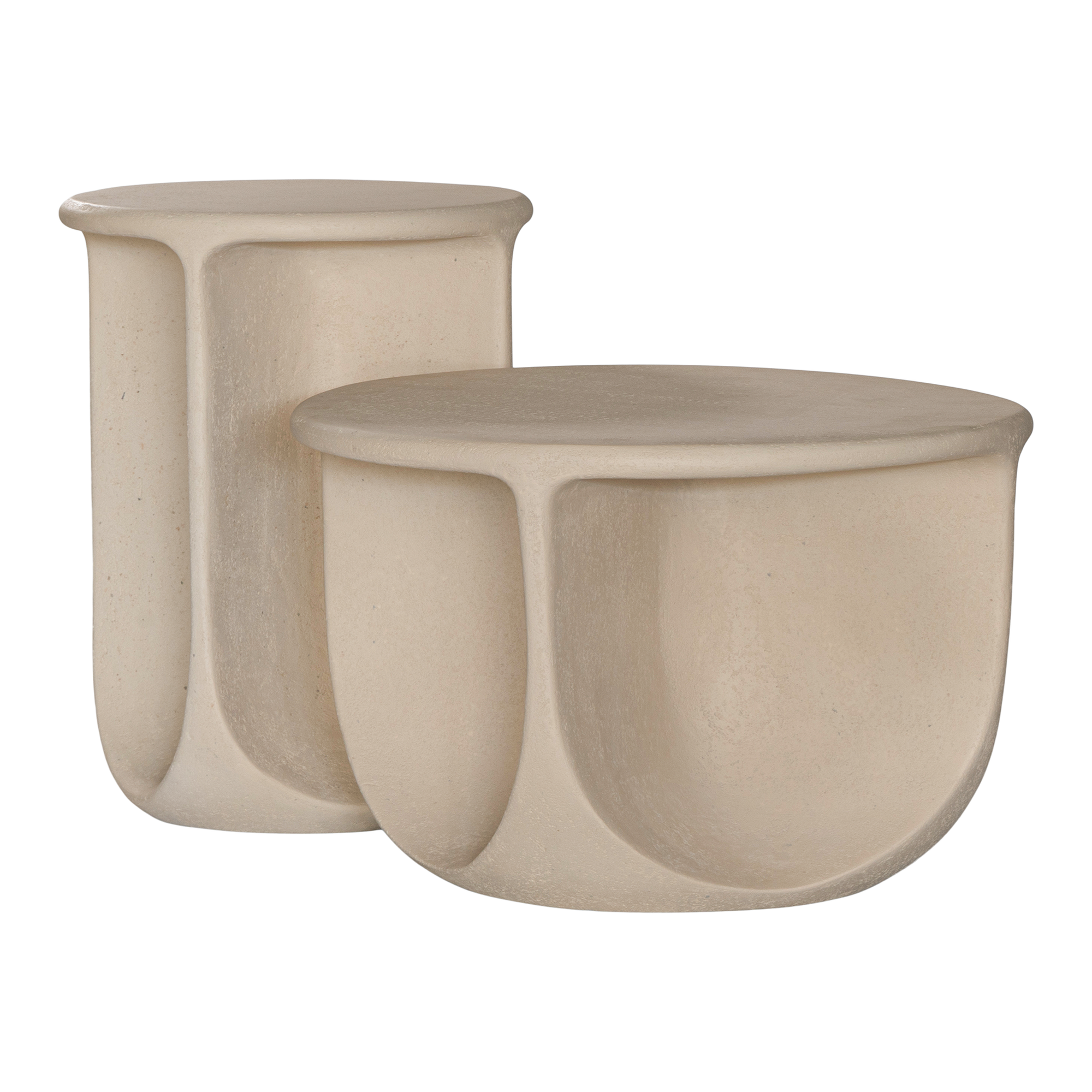 Berber side and coffee table in driftstone finish featuring sculptural curved legs and a softly rounded top with a textured natural surface.