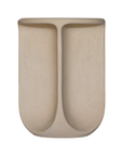 Berber side table in driftstone finish featuring sculptural curved legs and a softly rounded top with a textured natural surface.