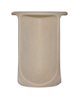 Berber side table in driftstone finish featuring sculptural curved legs and a softly rounded top with a textured natural surface.