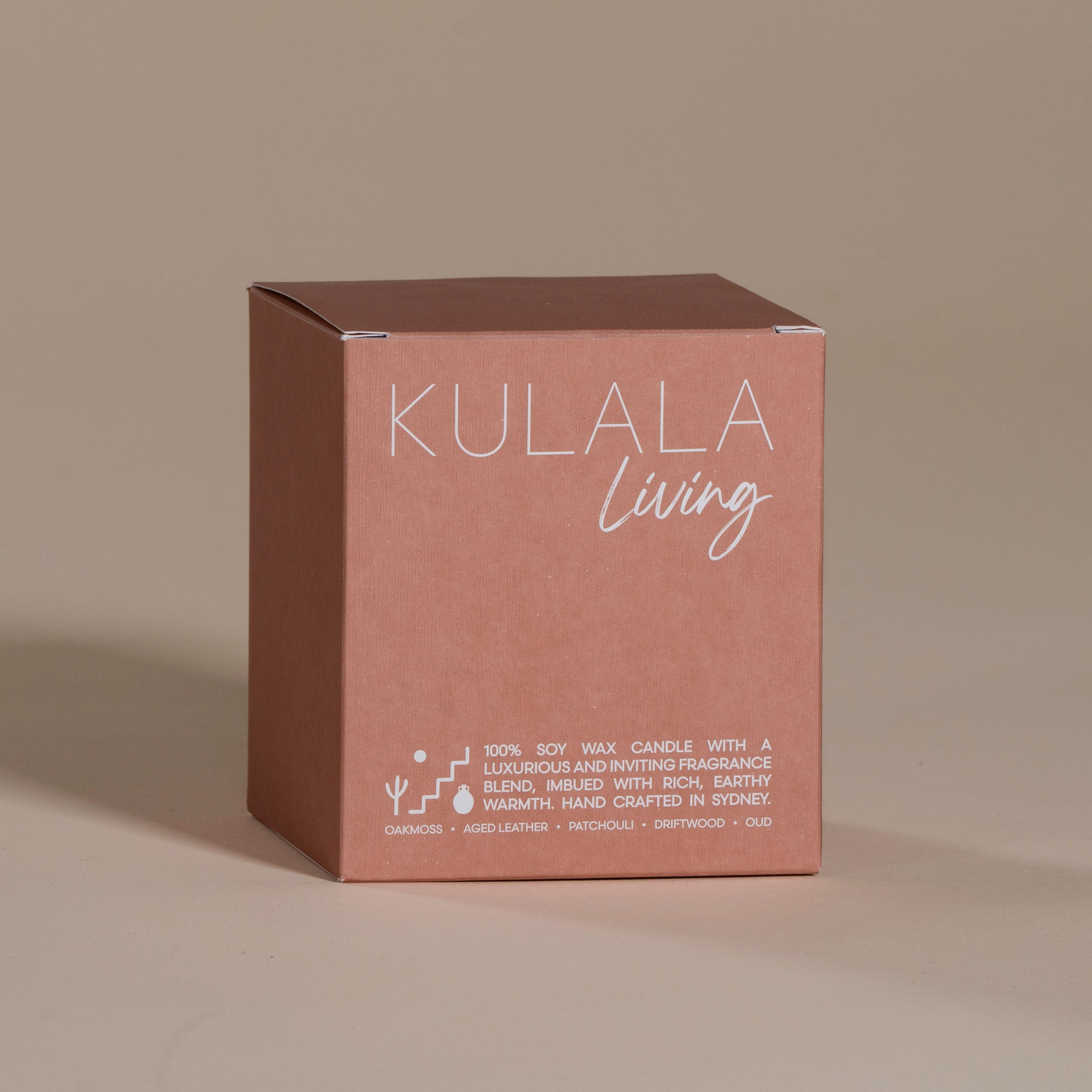 Kulala Living black candle with minimalist branding, featuring luxury soy wax candles in matte black vessels, set against a neutral background for a refined and elegant aesthetic