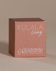 Kulala Living black candle with minimalist branding, featuring luxury soy wax candles in matte black vessels, set against a neutral background for a refined and elegant aesthetic