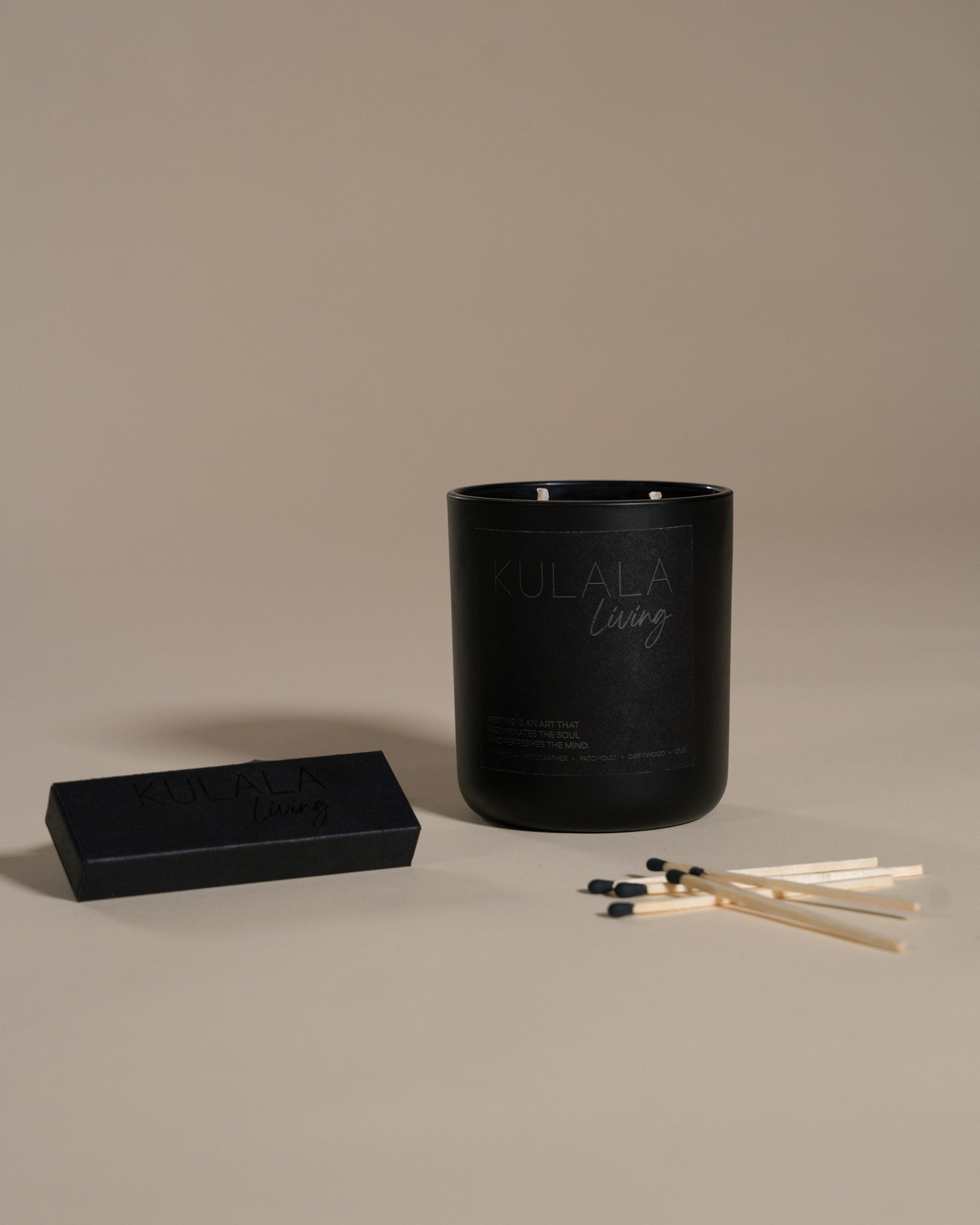 Kulala Living black candle set with minimalist branding, featuring a luxury soy wax candle in a matte black vessel, set against a neutral background for a refined and elegant aesthetic