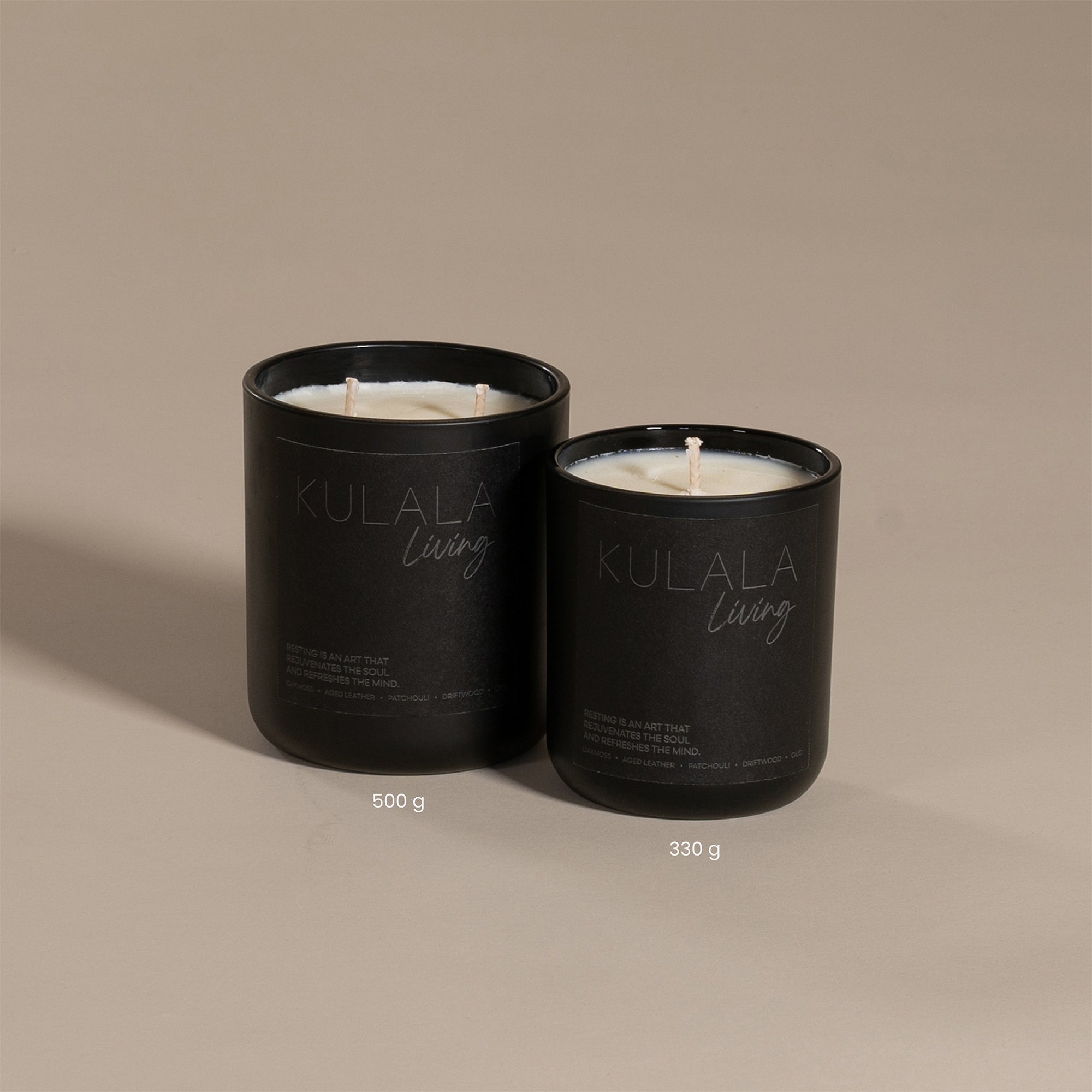 Kulala Living black candle set with minimalist branding, featuring two luxury soy wax candles in matte black vessels, set against a neutral background for a refined and elegant aesthetic