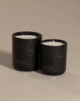 Kulala Living black candle set with minimalist branding, featuring two luxury soy wax candles in matte black vessels, set against a neutral background for a refined and elegant aesthetic