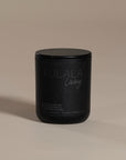 Kulala Living black candle with minimalist branding, featuring a luxury soy wax candle in matte black vessels, set against a neutral background for a refined and elegant aesthetic