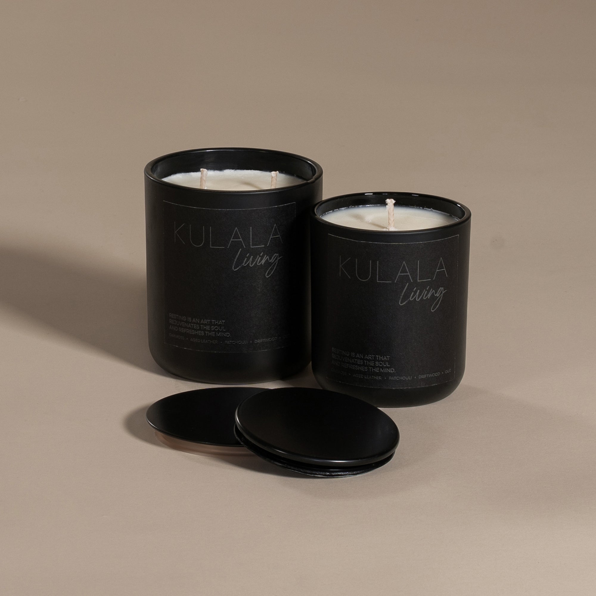 Kulala Living black candle set with minimalist branding, featuring two luxury soy wax candles in matte black vessels, set against a neutral background for a refined and elegant aesthetic