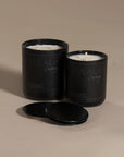 Kulala Living black candle set with minimalist branding, featuring two luxury soy wax candles in matte black vessels, set against a neutral background for a refined and elegant aesthetic