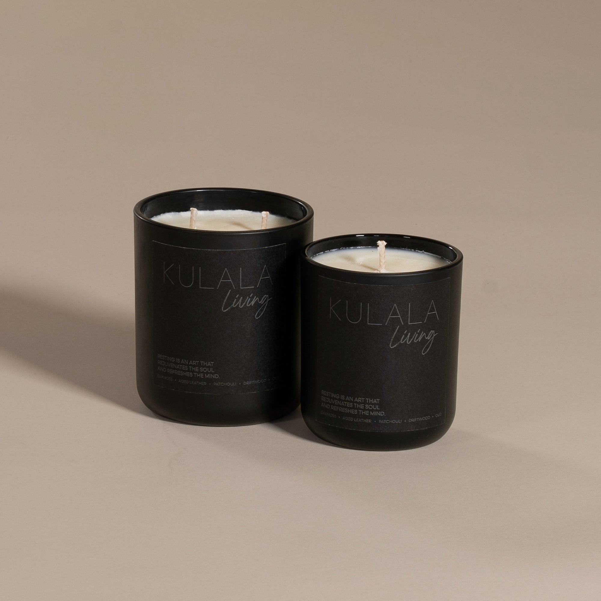 Kulala Living black candle set with minimalist branding, featuring two luxury soy wax candles in matte black vessels, set against a neutral background for a refined and elegant aesthetic