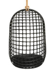A stylish black hanging chair with an open-weave design, suspended by a natural rope and featuring a plush black cushion for ultimate relaxation