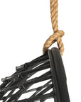A stylish black hanging chair with an open-weave design, suspended by a natural rope and featuring a plush black cushion for ultimate relaxation