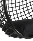 A stylish black hanging chair with an open-weave design, suspended by a natural rope and featuring a plush black cushion for ultimate relaxation