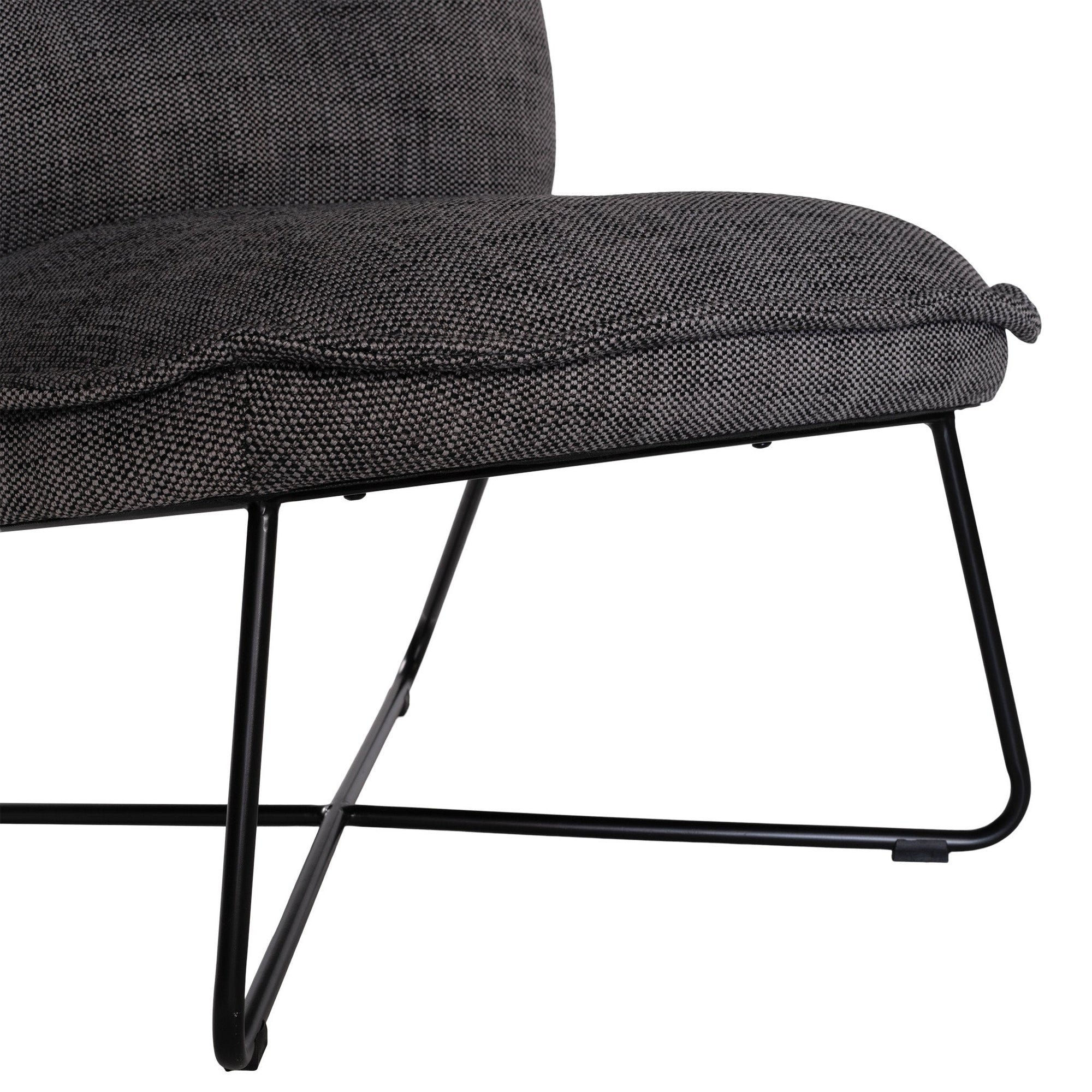 A modern black lounge chair featuring a cushioned seat and backrest upholstered in textured dark linen fabric. Designed with a sleek metal frame, this chair offers a stylish and comfortable seating option for contemporary interiors