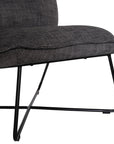 A modern black lounge chair featuring a cushioned seat and backrest upholstered in textured dark linen fabric. Designed with a sleek metal frame, this chair offers a stylish and comfortable seating option for contemporary interiors