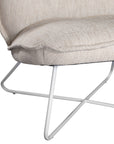 A modern natural lounge chair featuring a cushioned seat and backrest upholstered in textured linen fabric. Designed with a sleek metal frame, this chair offers a stylish and comfortable seating option for contemporary interiors