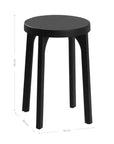 A sleek black oak round stool featuring a minimalist design with subtly curved legs. Crafted from solid oak with a matte black finish, this versatile piece functions as a stool or side table, adding a modern touch to any space