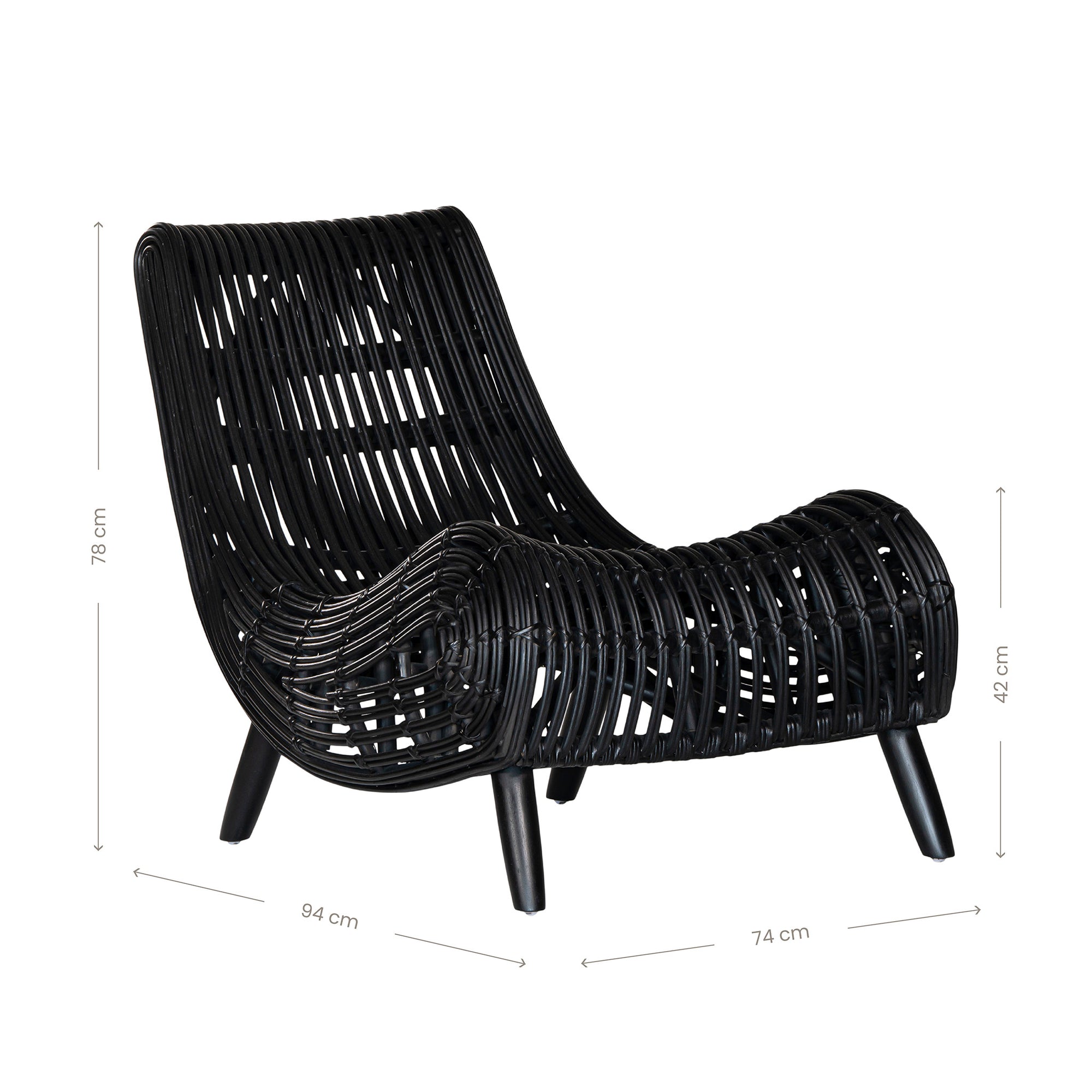 A sculptural black rattan lounge chair with a curved, low-profile silhouette and sleek wooden legs. The woven design adds texture, while the deep seat and ergonomic shape offer comfort and relaxation