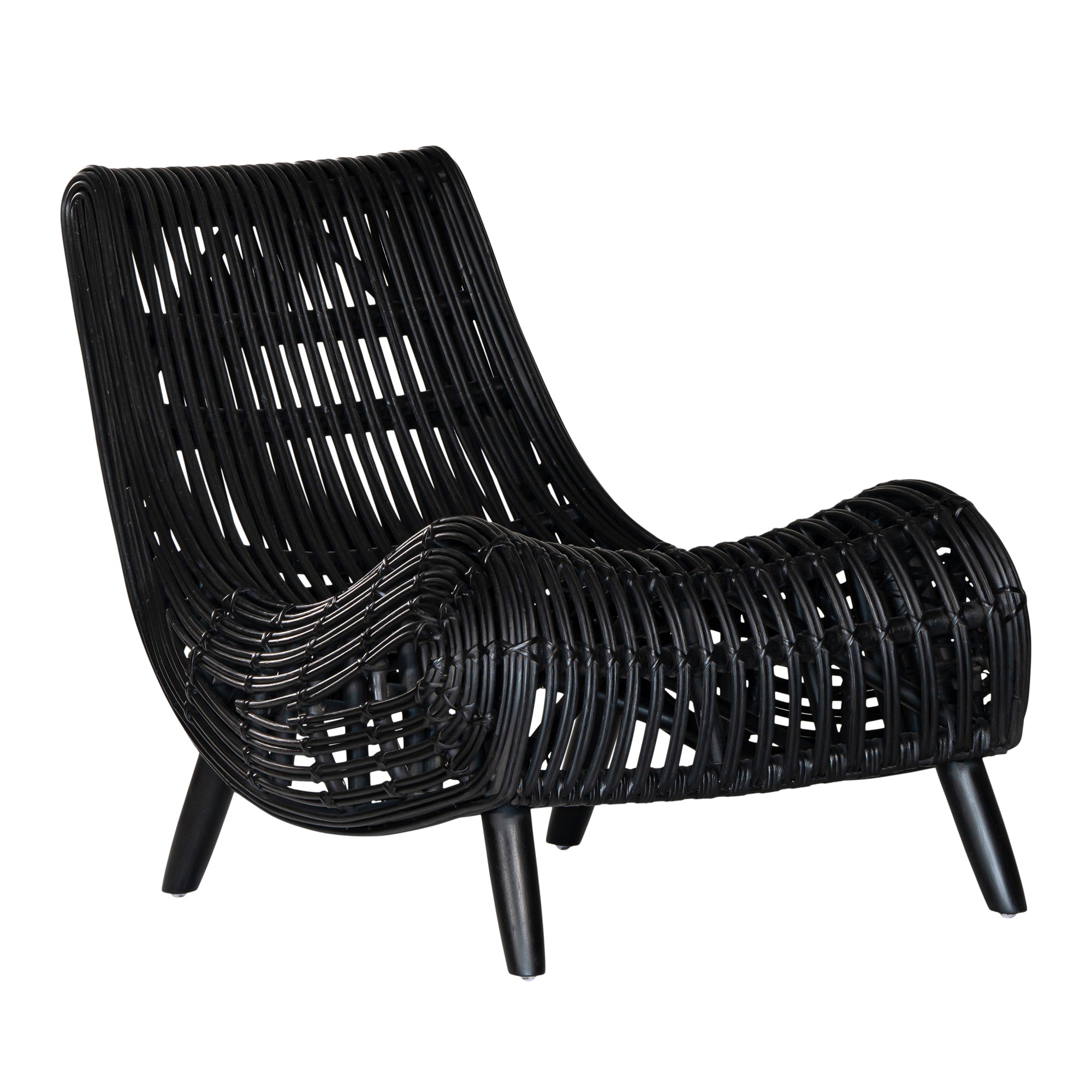 A sculptural black rattan lounge chair with a curved, low-profile silhouette and sleek wooden legs. The woven design adds texture, while the deep seat and ergonomic shape offer comfort and relaxation