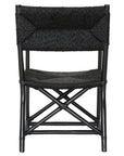 Black wicker armchair with armrests and a sturdy cross-frame base, showcasing a contemporary design suitable for indoor or outdoor dining spaces.