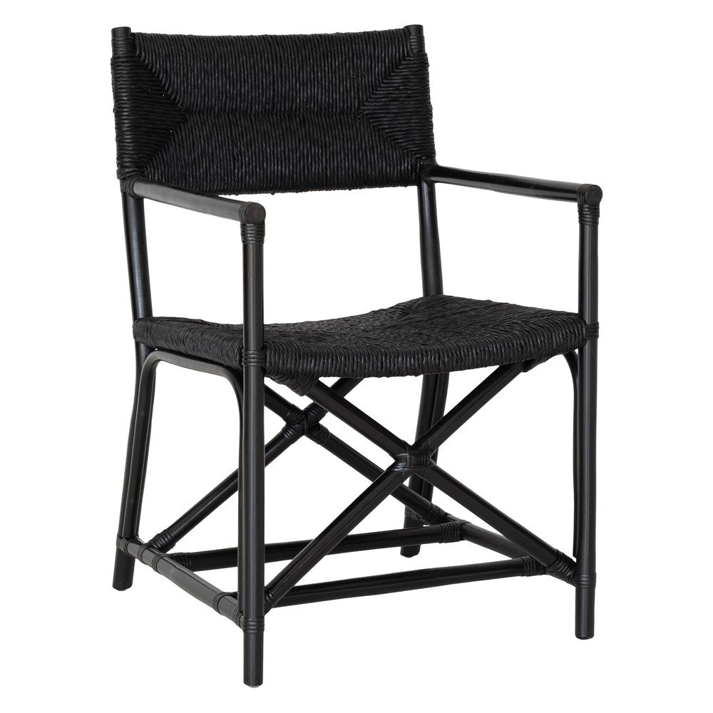 Black wicker armchair with armrests and a sturdy cross-frame base, showcasing a contemporary design suitable for indoor or outdoor dining spaces.