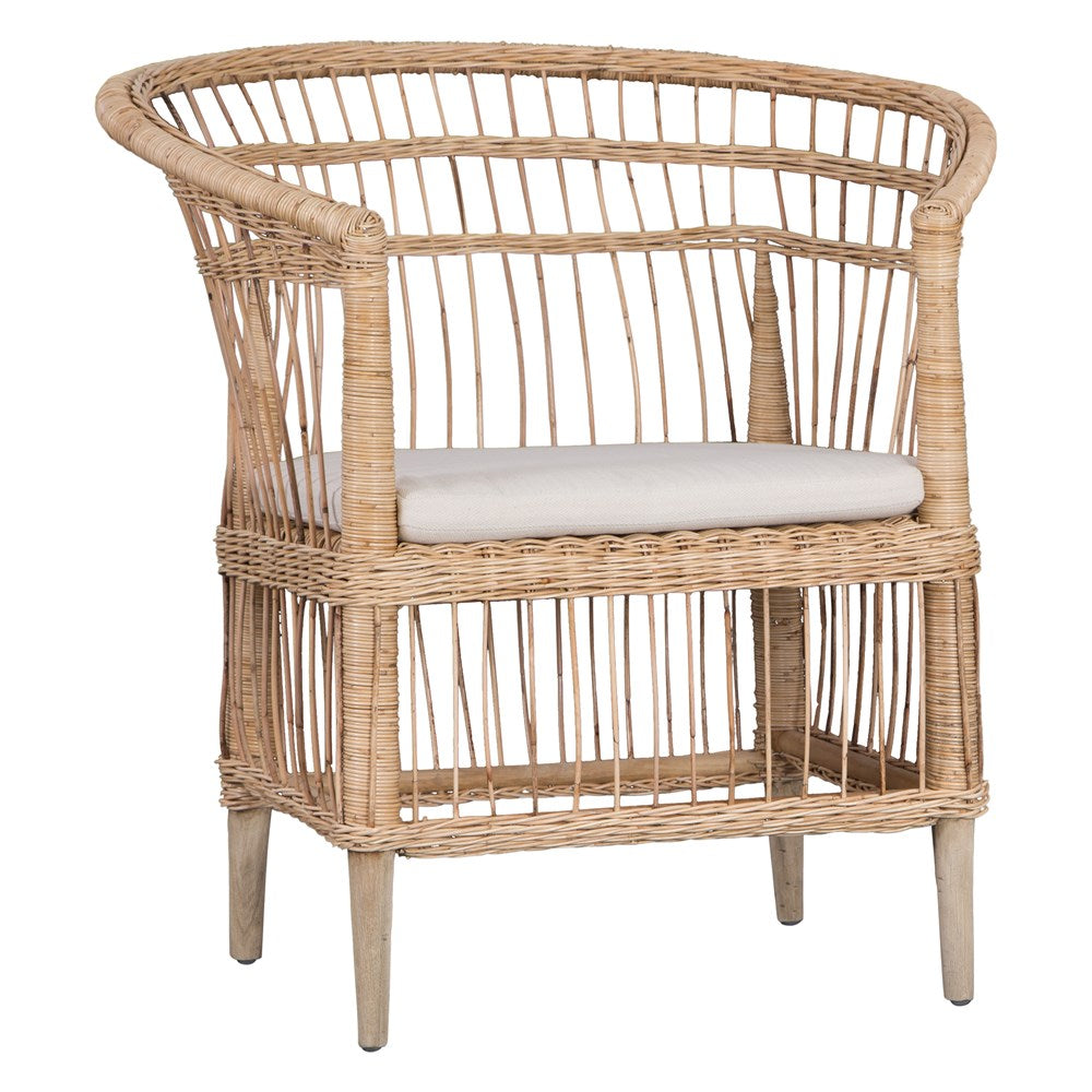 A beautifully crafted blonde rattan armchair with an open-weave design and a white cushioned seat, perfect for adding a relaxed coastal touch to any space.
