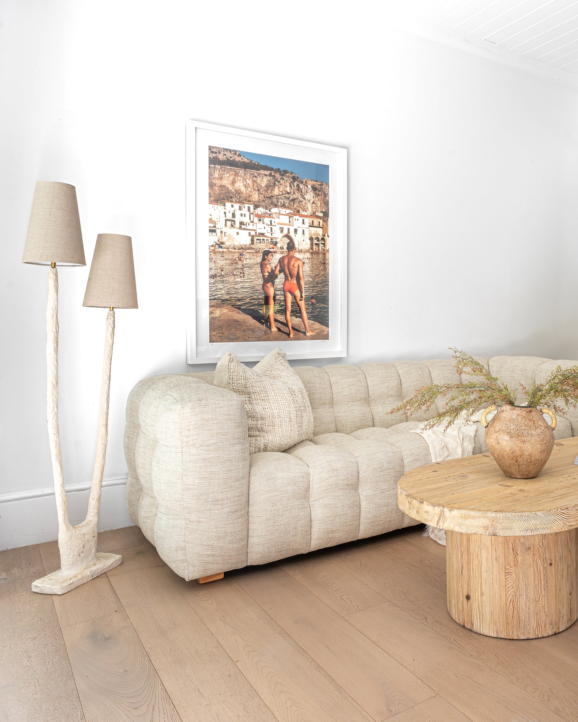 Cairo Cushion in Natural adds organic texture and softness to a relaxed neutral living room.
