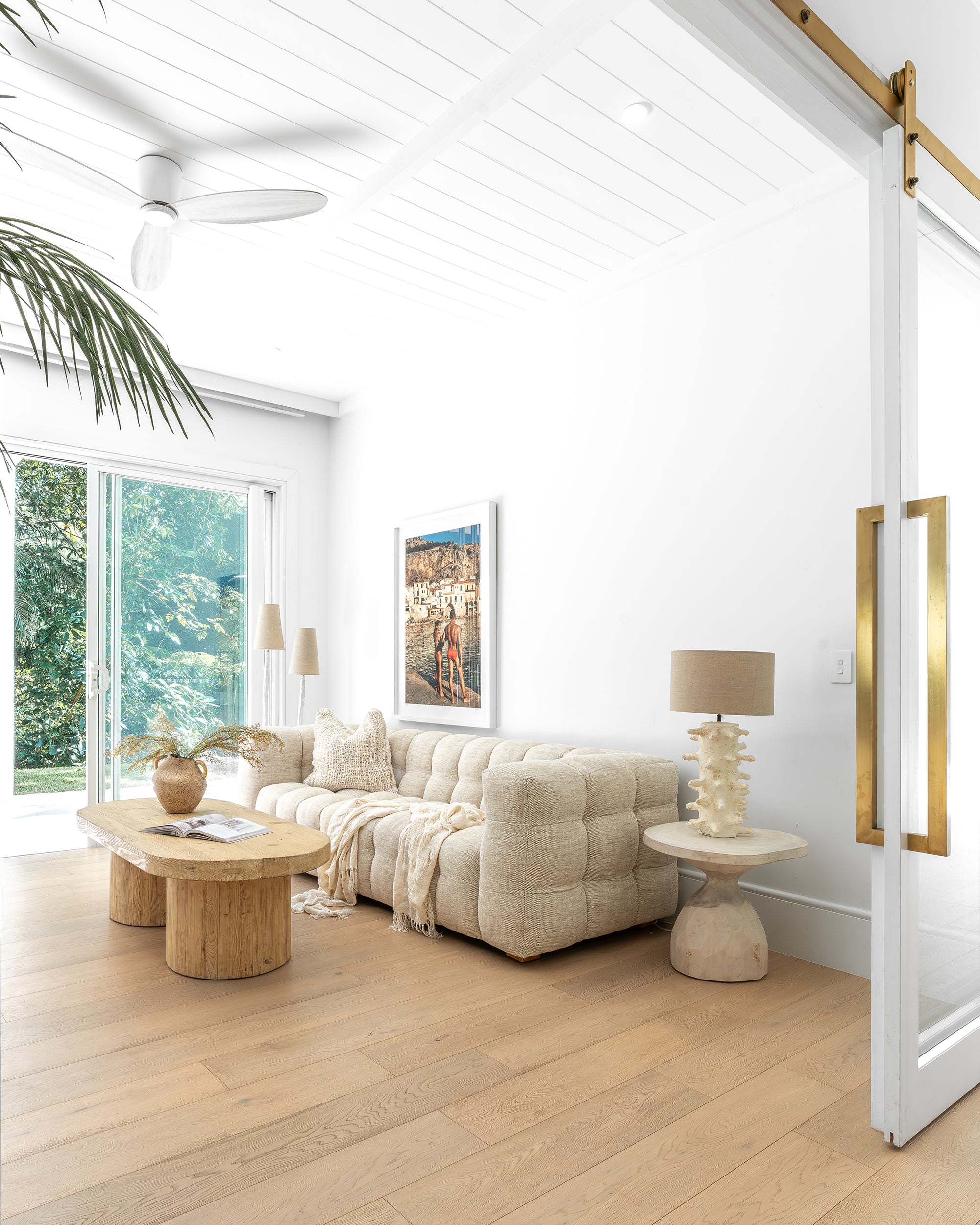 Cairo Cushion in Natural adds organic texture and softness to a relaxed neutral living room.