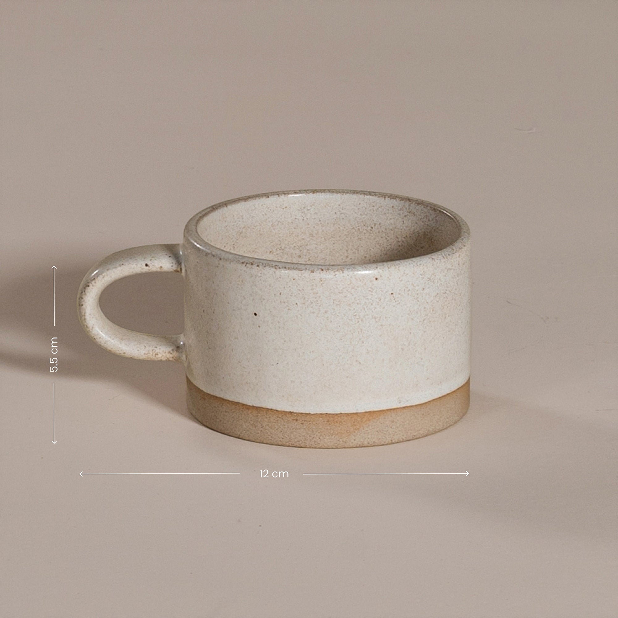 A beautifully handcrafted ceramic coffee mug and matching cup, featuring a minimalist stoneware design with a natural speckled glaze and raw clay base. Perfect for enjoying your morning coffee or tea in a timeless, artisanal style