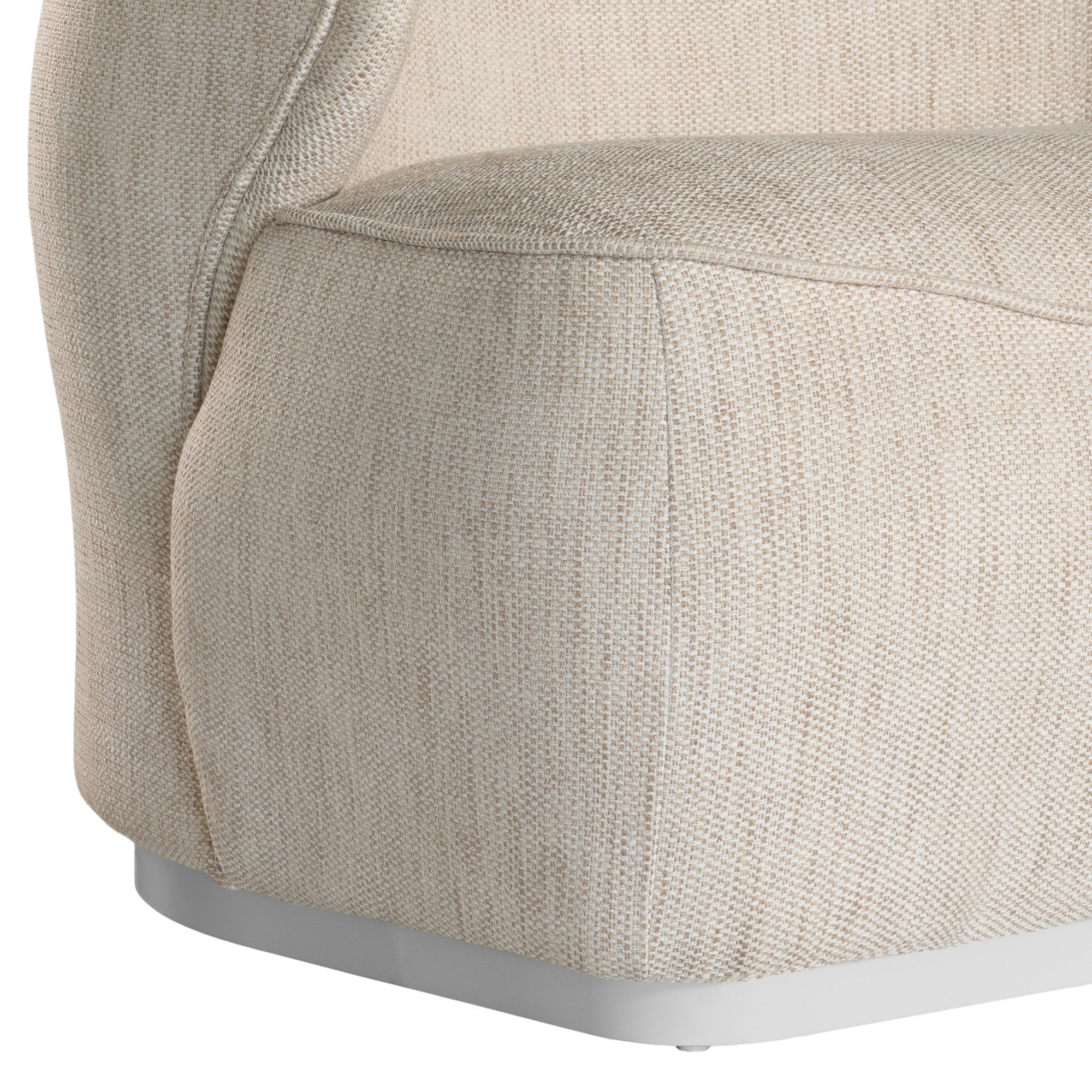 Coroo occasional chair in natural textured fabric with a soft curved backrest and rounded silhouette on a low plinth base.