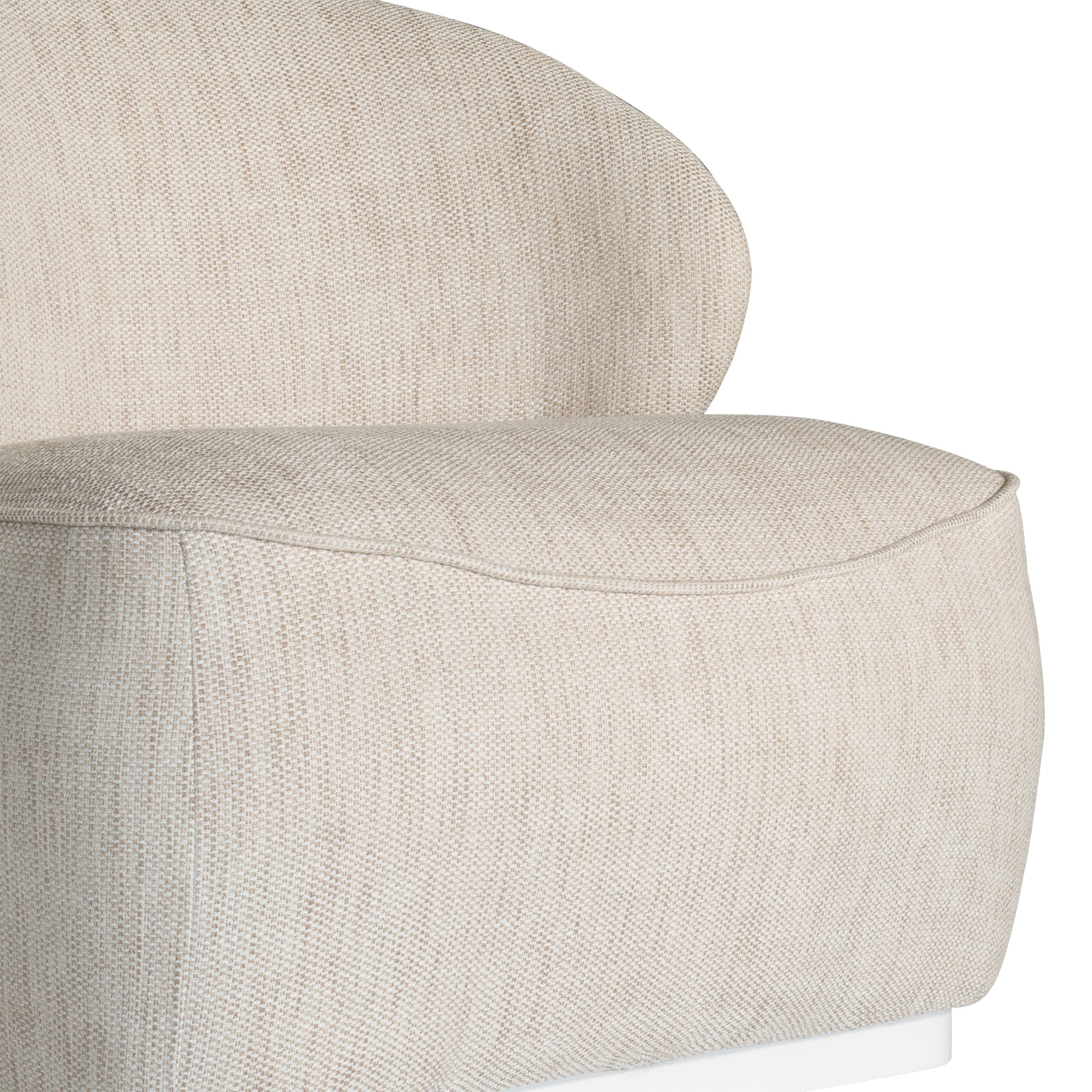 Coroo occasional chair in natural textured fabric with a soft curved backrest and rounded silhouette on a low plinth base.
