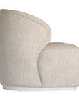 Coroo occasional chair in natural textured fabric with a soft curved backrest and rounded silhouette on a low plinth base.