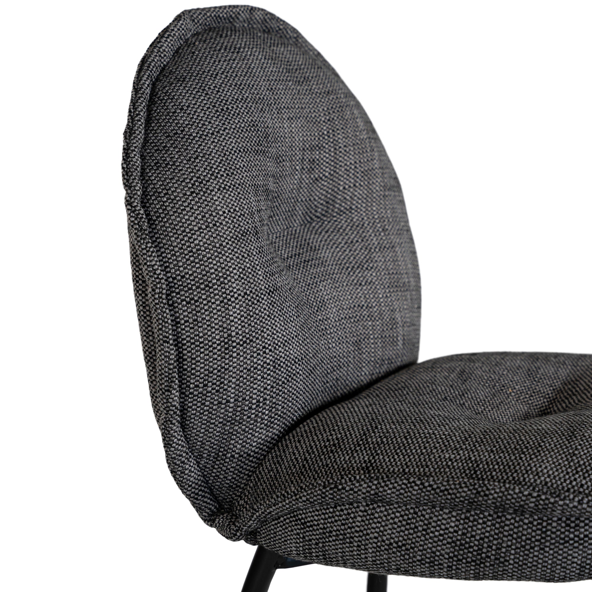 Contemporary dark grey upholstered dining chair with a plush, rounded backrest and cushioned seat, supported by sleek black metal legs for a sophisticated modern look