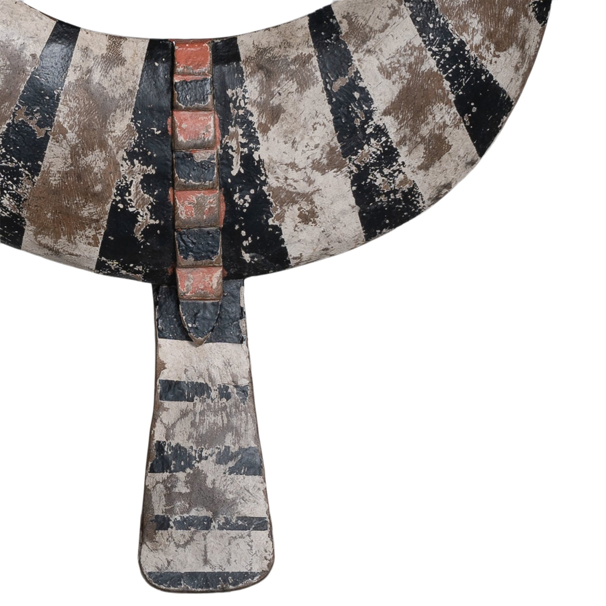 A striking decorative tribal horn sculpture with bold black and natural tones, mounted on a sleek black stand, adding an artisanal touch to modern interiors.