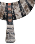 A striking decorative tribal horn sculpture with bold black and natural tones, mounted on a sleek black stand, adding an artisanal touch to modern interiors.